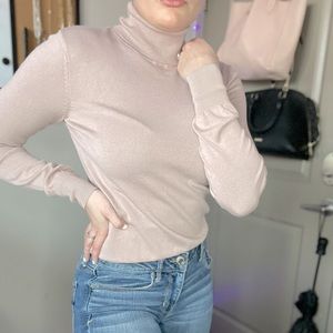 Blush colored turtleneck top